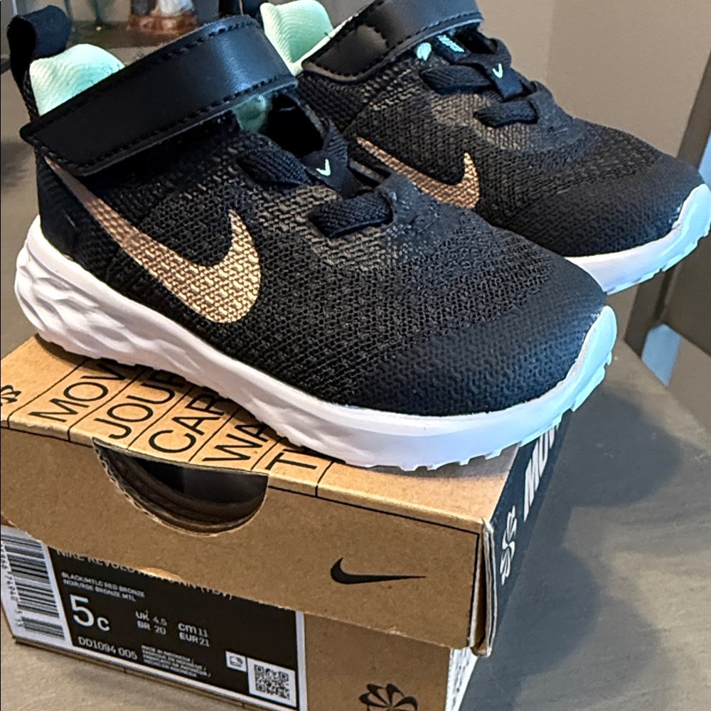 Nike Kids Black and Gold Sneakers